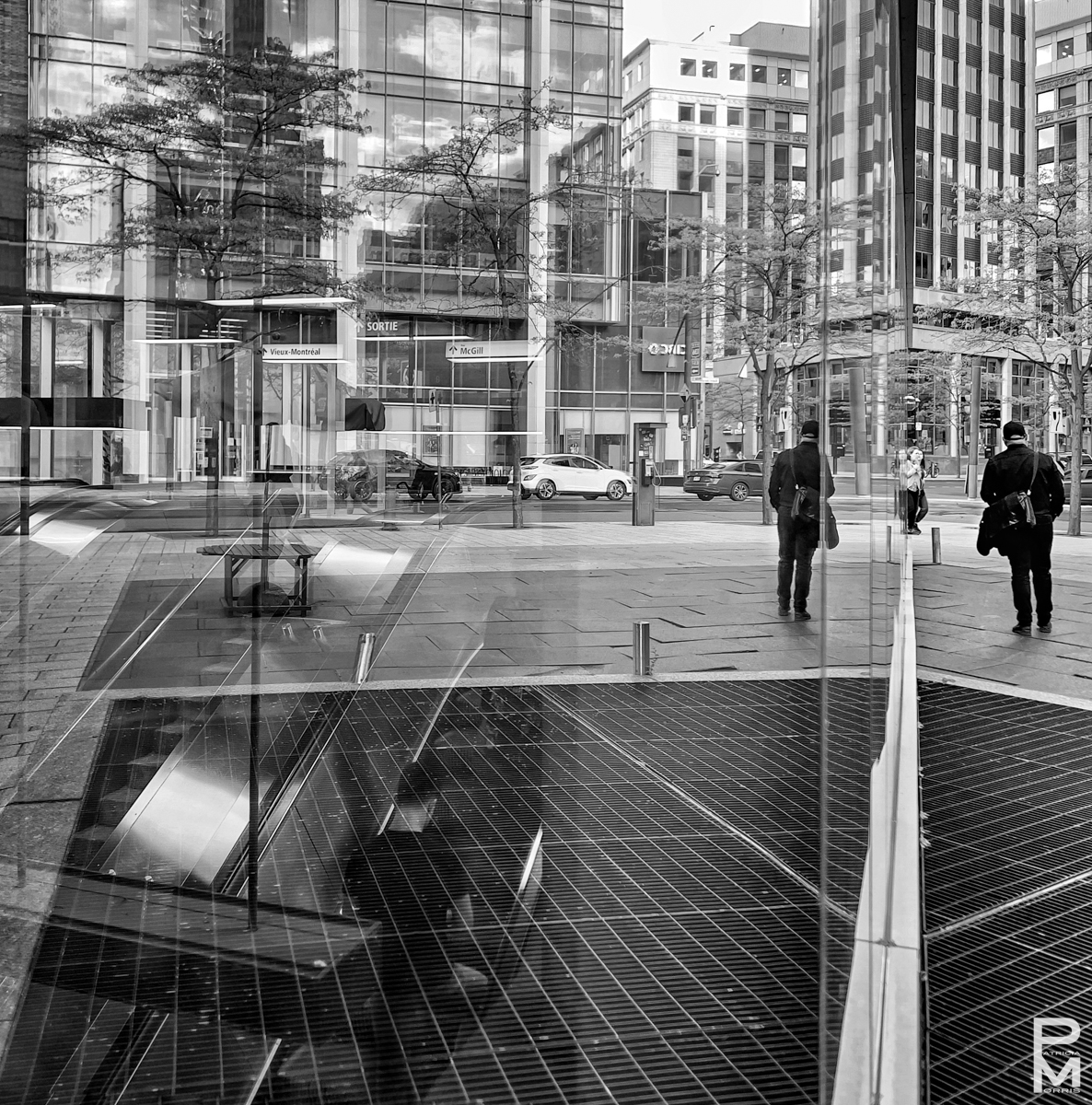 Victoria Square metro station with many reflections and a man emergingfrom below,In Transit 12