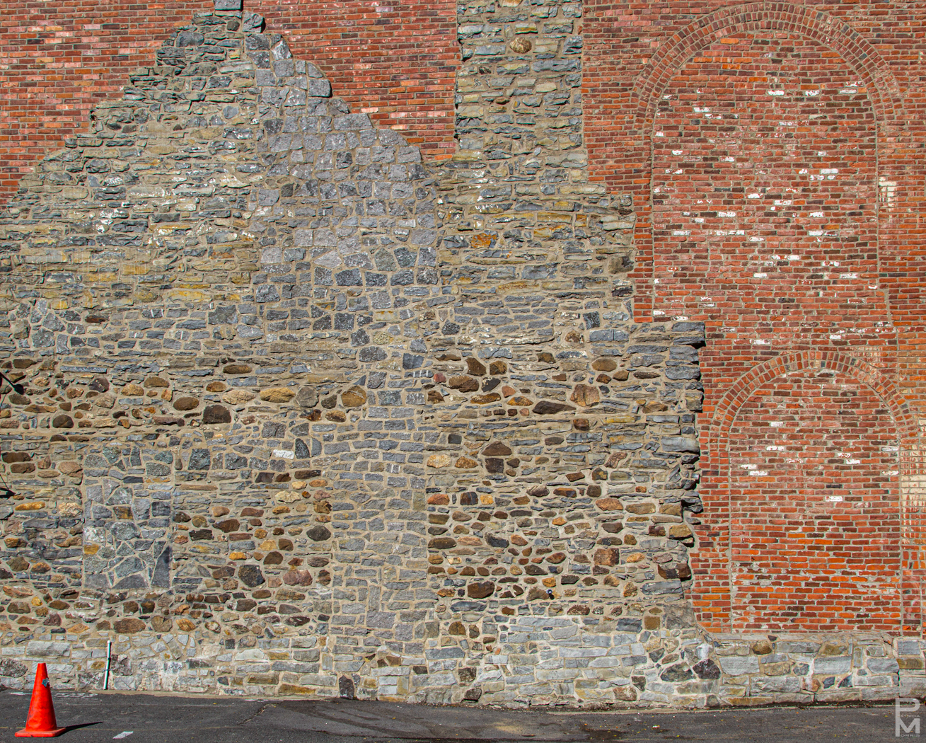 Digital image of a building in Old Montreal showing changes in brickwork over decades